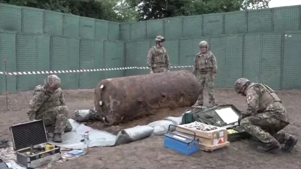 NATO forces, protected by JOESCO JOESCO barriers, cleared unexploded bombs from WWII.